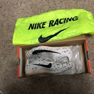 White player black Nike track spikes(bag included)